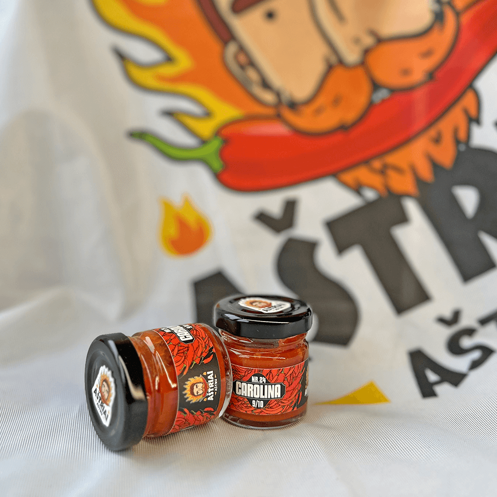 Nr. 24 Carolina MINI hot sauce jars featuring bold graphics with fiery elements and branding.
